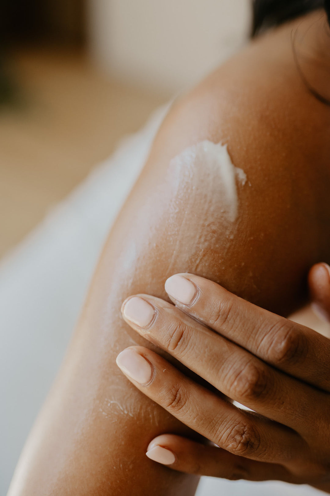 Person Using Tallow Lotion on Arm By Eternal Tallow