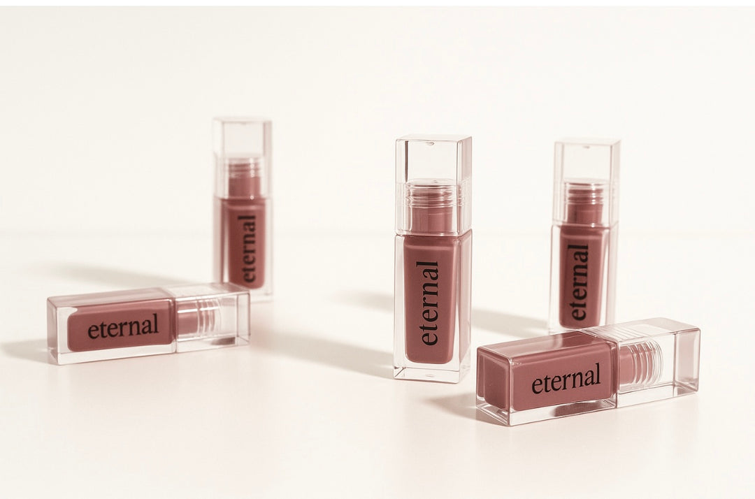 jojoba Lip gloss with 'eternal tallow' branding on a white background