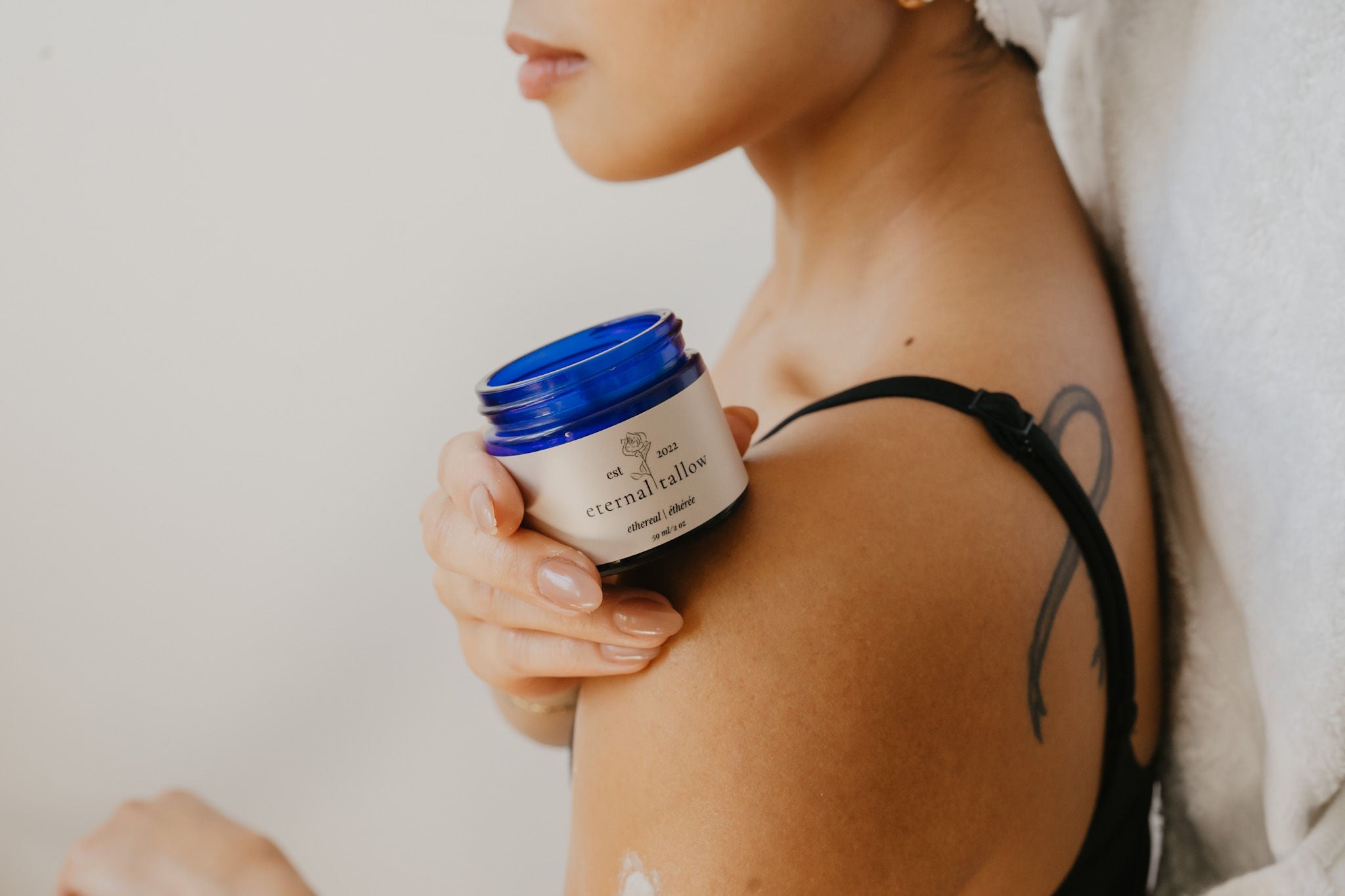 Tallow skincare before and after featuring woman holding eternal tallow balm